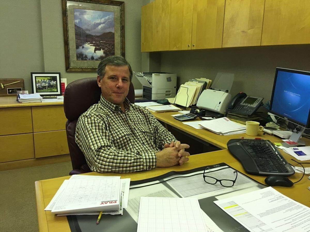 Mark Grigsby sitting at this desk.